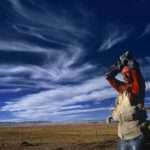 Man looking after cattle on the Tibetan plateau